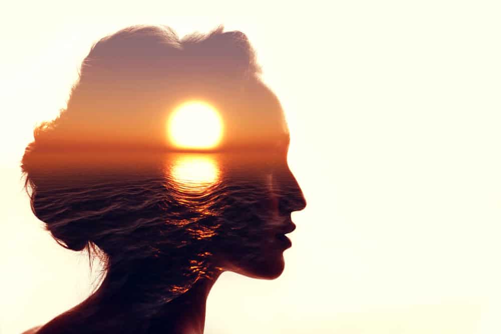 Psychology Concept. Sunrise And Woman Silhouette.